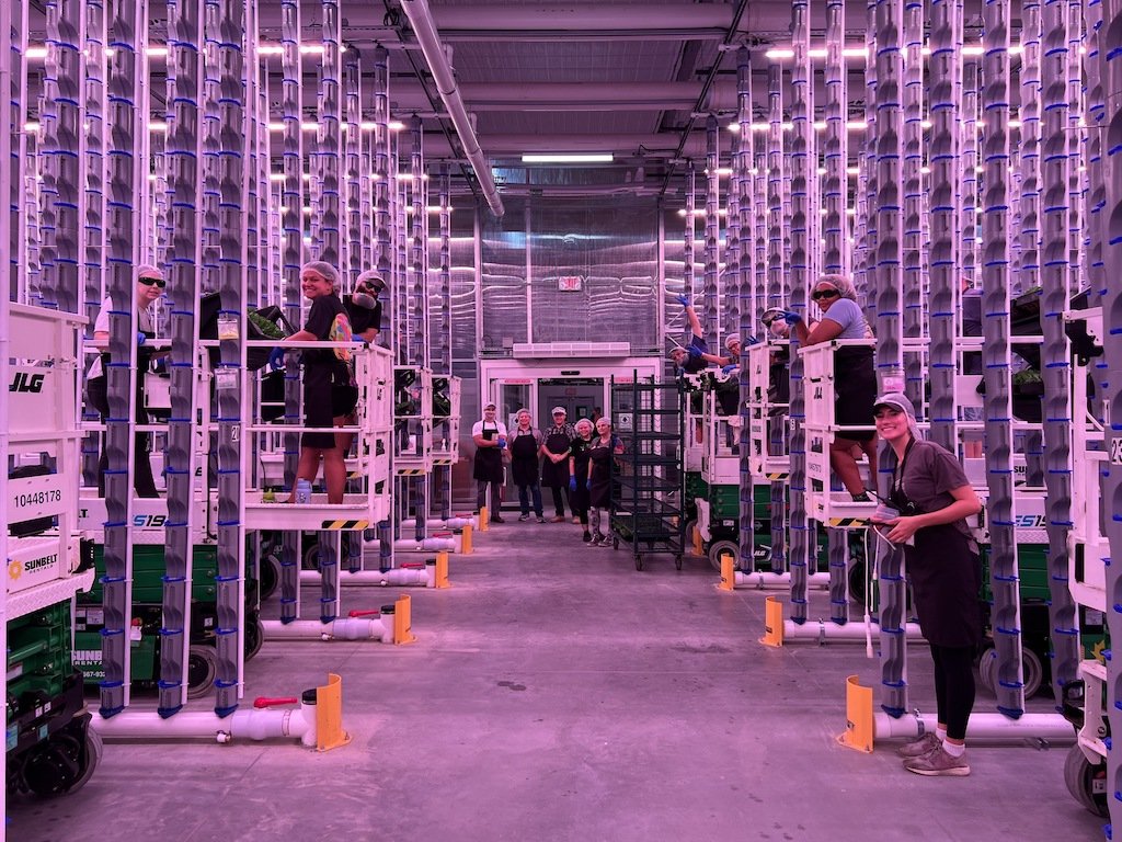 Vertical farmers smiling at eden green technology.jpg